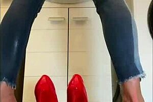 European housewife in red high heels gets wet