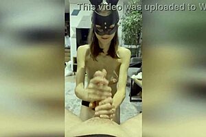 Beautiful brunette gets a facial on her tits while giving a great handjob