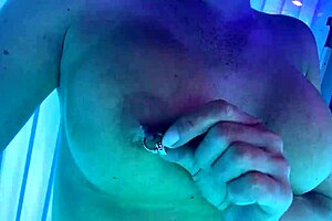 Big tits and solo action in a tanning bed