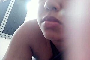 Brunette teen gives a blowjob and gets natural tits bounced in homemade video