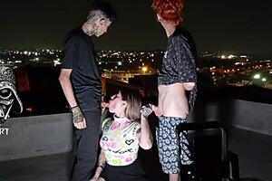 A sexy girl gave herself to two generous men on the roof