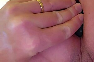 An amateur woman has her asshole filled with a plug during sex