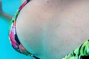 Husband films wife at hotel pool with two guys