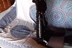 brunette milf in total black fishnets pantyhose and over the knee boots