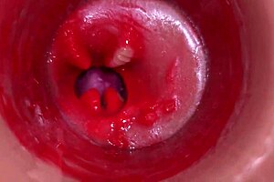 Camera captures inside vagina during cervix POV creampie session in close-up action.