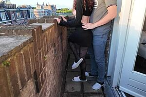 on the balcony a skinny teen in dress rides bent over during outdoor action leading to orgasm