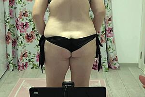 plump mature milf shakes her big ass in various thongs on webcam, showing off hairy pussy and lingerie collection