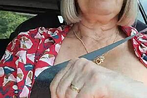 Riding down the road with my tits out flashing in public