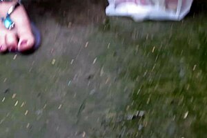 this gorgeous plump milf sits on a street bench smoking a cigarette while pissing outdoors in amateur fetish style