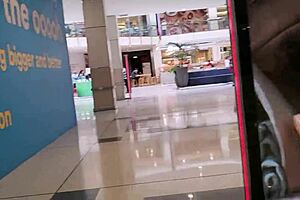 This trashy kiwi slut flashes her tattooed body and pierced pussy at the mall before heading to a busy public street.