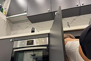 hot tattooed blonde with long hair strips panties in kitchen revealing meaty pussy and sexy ass