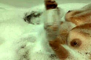 Tanned stepsister plays with wet pussy and big natural tits in bathroom