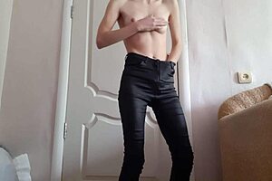 Trembling with desire, skinny student rubs to orgasm in tight leather jeans
